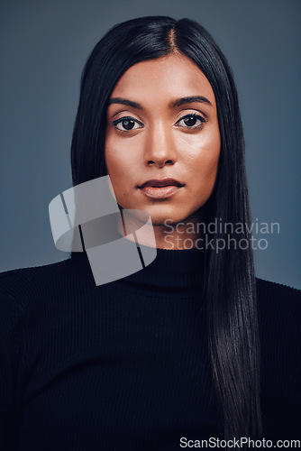 Image of Face, natural and beauty of serious woman in studio isolated on a gray background. Portrait, skincare cosmetics and Indian model with spa facial treatment for aesthetic, healthy skin and wellness.