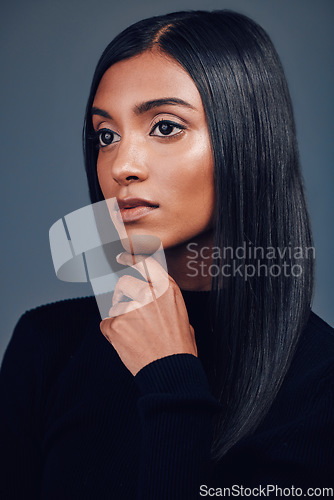 Image of Face, makeup and beauty with woman and skin, cosmetic shine and hair isolated on studio background. Haircare, keratin treatment and cosmetology, shine with Indian female model thinking and glow