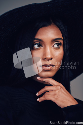 Image of Fashion, woman in hat and beauty, thinking with makeup and elegance, glamour with luxury on studio background. Designer clothes, black aesthetic and female model with vintage style and cosmetic shine