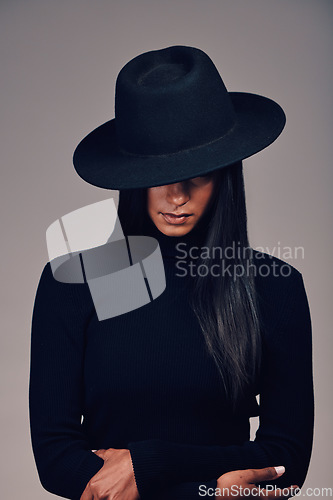 Image of Fashion, woman in hat and beauty, dark and mystery with glamour and luxury isolated on studio background. Designer clothes, black aesthetic and female model, vintage style with cosmetics and edgy