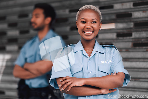 Image of Portrait, security or law enforcement and a happy black woman arms crossed with a man colleague on the street. Safety, smile and duty with a crime prevention unity working as a team in an urban city