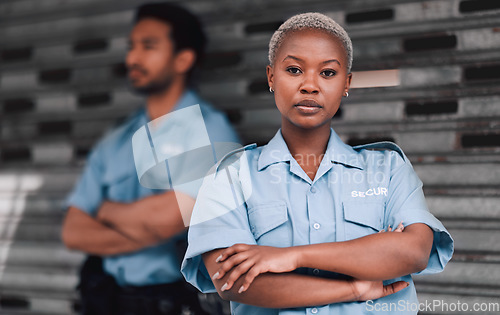 Image of Portrait, security or law enforcement and a serious woman arms crossed with a man colleague on the street. Safety. focus and duty with a crime prevention unity working as a team in an urban city