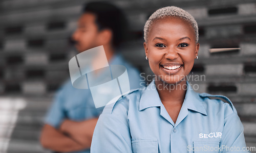 Image of Portrait, security or safety and a happy black woman in the city with a man colleague on the street. Law enforcement, smile and duty with a crime prevention unit working as a team in an urban town