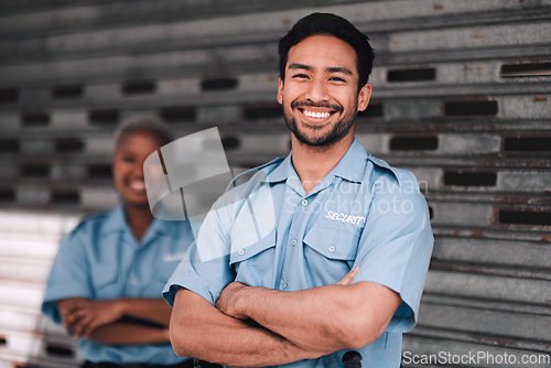 Image of Portrait, security or safety and a happy man arms crossed with a black woman colleague on the street. Law enforcement, smile and duty with a crime prevention unit working as a team in the city