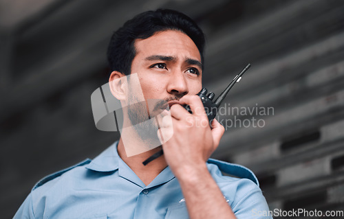 Image of Walkie talkie, security guard or safety officer man outdoor for protection, patrol or watch. Law enforcement, transceiver and duty with a crime prevention male worker in uniform with communication