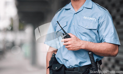 Image of Walkie talkie, security guard or safety officer man on the street for protection, patrol or watch. Law enforcement, hand and duty with a crime prevention male worker in uniform in the city