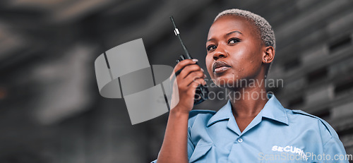 Image of Security, radio and a black woman police officer in the city during her patrol for safety or law enforcement. Walkie talkie, communication and service with a female guard on a street in an urban town