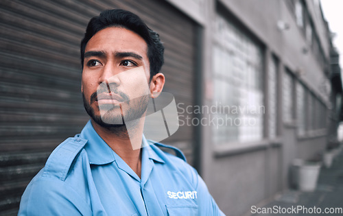 Image of Serious, security guard or safety officer man on the street for protection, patrol or watch. Law enforcement, focus and duty with a crime prevention male worker in uniform in the city