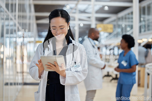 Image of Doctor, asian woman and tablet for medical planning, data research and healthcare app in busy hospital. Happy female therapist, digital technology and consulting information for telehealth in clinic