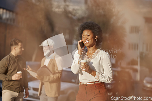 Image of Phone call, coffee and a business black woman in the city for communication on her morning commute. Mobile, contact and travel with a happy young female employee walking outdoor in an urban town