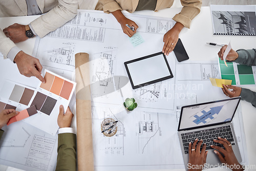 Image of Architect, hands and blueprint design in meeting above for planning, strategy or architecture on office desk. Top view of creative people in team project or floor plan with color palette for startup