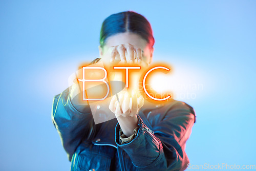 Image of Woman, hologram and btc with finance, business and promotion against a blue studio background. Female person, investment and model with a sign, financial and symbol for trading with profit growth