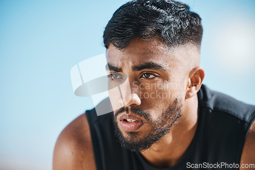 Image of Fitness, break and tired man outdoor breathing, rest and relax after training, workout or running. Face, breathe and Indian male runner stop to recover from exercise, challenge or sports performance