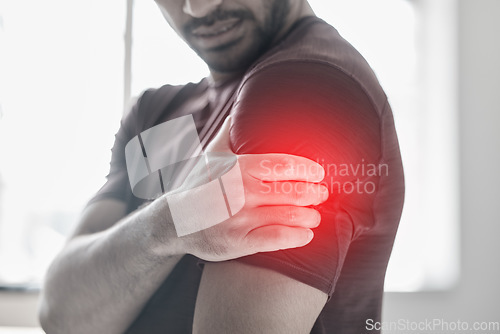 Image of Hand, arm pain and injury with a man shoulder in red highlight during a fitness workout. Healthcare, medical and anatomy with a male athlete holding a joint after an accident or emergency in the gym