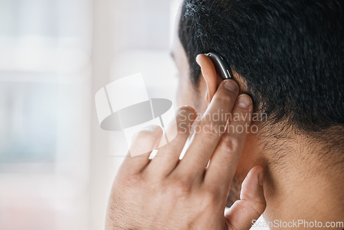 Image of Hearing aid, face and ear of man with disability from the back on mockup space. Closeup of deaf person, medical device or implant of sound waves, audiology or help of listening equipment for wellness