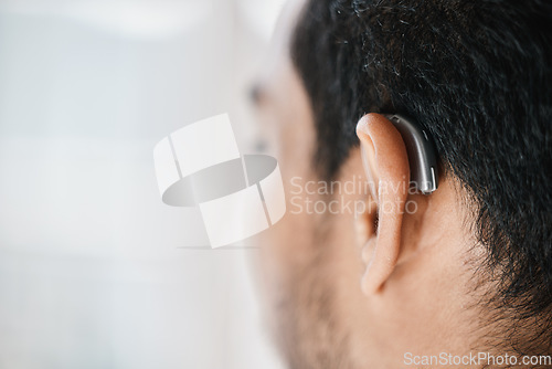 Image of Hearing aid, closeup or ear of man with disability from the back on mockup space. Deaf person, medical device or implant of sound waves, audiology or help of listening equipment, accessory or support