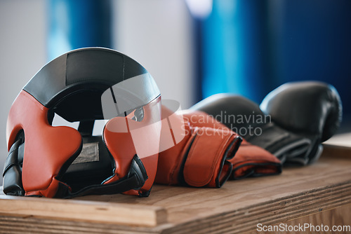 Image of Fitness, boxing glove and workout for training in closeup in gym for mma competition for punch. Protection, exercise and fighting sport equipment at health centre for challenge or fight and wellness.