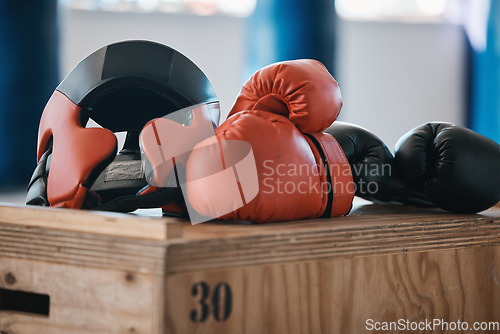 Image of Gym, equipment and helmet with gloves for boxing fitness, commitment and inspiration in sports training. Kickboxing tools, safety and security in fight exercise, competition goals and fit motivation.