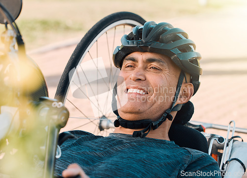 Image of Happy man with disability, handcycle and bike for sports, race or cardio contest. Bicycle, male cyclist or face of athlete with paraplegia cycling in competition, challenge or smile of outdoor action