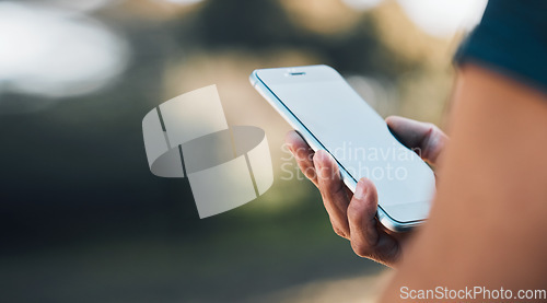 Image of Closeup hands, phone and communication for social media, networking or chat on mockup screen in nature outdoors. Person, mobile or smartphone app for texting, online browsing or mock up space banner