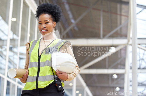 Image of Black woman, blueprint or architect walking on construction site for project management or inspection. Engineering, thinking or designer with floor plan for architecture, development or innovation