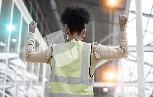 Image of Woman, success or architect in celebration of deal for industrial property or real estate with hands up. Back view, winner or happy designer with goals, target or achievement for engineering growth