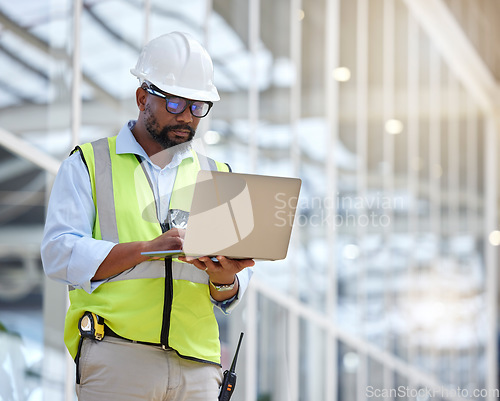 Image of Architecture, research and laptop with black man in warehouse for engineering, building and design. Technology, planning and digital with contractor focus for project management and graphic