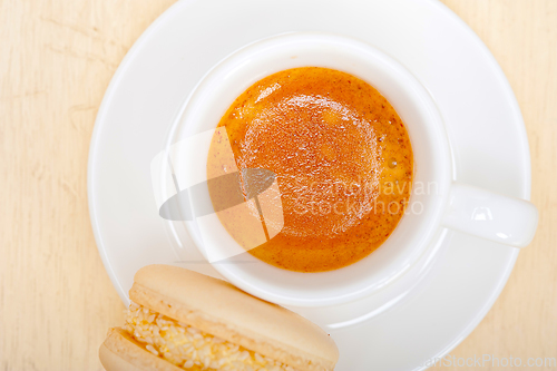 Image of colorful macaroons with espresso coffee