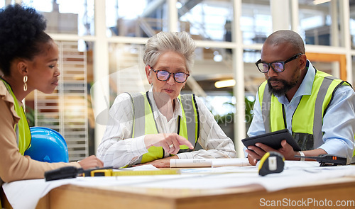 Image of Blueprint, meeting or civil engineering team planning a building or construction architecture in office. Teamwork, collaboration or group of senior designers talking or speaking of floor plan ideas