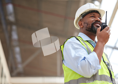 Image of Walkie talkie, black man and engineer planning, communication and construction. African architect, radio and happy contractor with industrial project, building maintenance and engineering discussion.