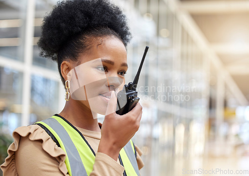 Image of Walkie talkie, black woman and engineer talking for communication, construction and listening. African architect, radio and contractor planning industrial project, building maintenance and logistics.