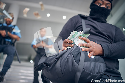 Image of Bank, robbery and police running after criminal for justice, punishment and safety, serious and danger. Crime, corruption and man robber with stolen money running for security, law or financial loss