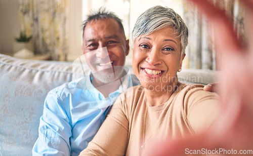 Image of Selfie, home and senior couple with love, relax and happiness with romance, bonding and marriage. Portrait, old man and elderly woman on a couch, social media and profile picture with a relationship