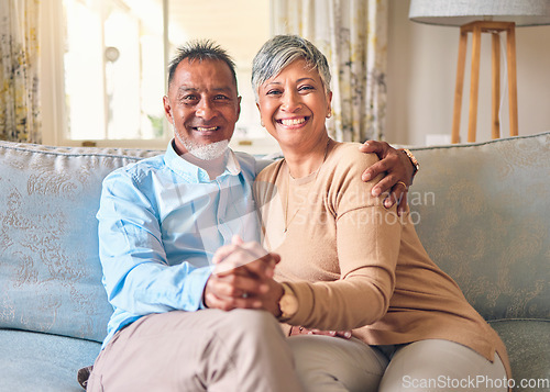 Image of Senior couple, portrait and holding hands on sofa in home living room, bonding and love. Smile, elderly man and happy woman relax with romance, care and enjoying retirement together in house lounge.