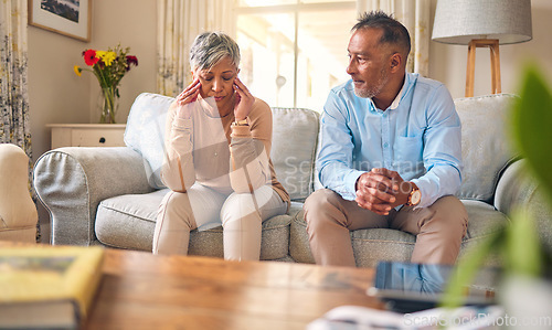 Image of Senior couple, fight and divorce in stress, conflict or argument from disagreement on living room sofa at home. Elderly man and woman in depression, infertility or toxic relationship in the house