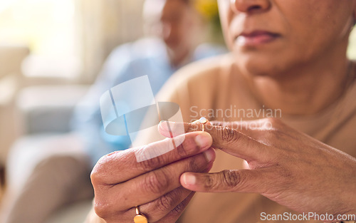 Image of Senior couple, hands and ring in divorce, fight or conflict from disagreement or argument on sofa at home. Elderly man and woman in depression, infertility or cheating and toxic marriage in the house