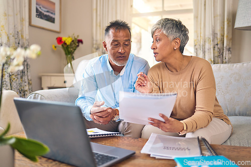 Image of Laptop, documents and accounting with a senior couple in the home living room for retirement or finance planning. Computer, budget or investment savings with a mature man and woman in a house