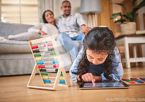 Image of Child, toys for learning and tablet for education in family home with abacus on the floor with mom, dad in living room with a game. Girl, development in math and couple together on couch in house