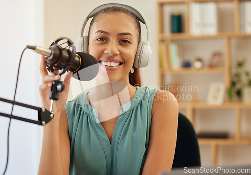 Image of Microphone, headphones and portrait of happy woman on podcast or live stream, media broadcast on radio. Streaming, influencer or content creator with mic, smile and internet networking in home office