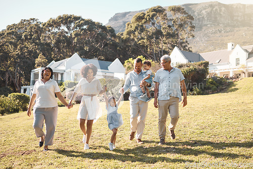 Image of Holding hands, kids and a blended family walking in the garden of their home together during summer. Grandparents, parents and children on grass in the backyard of a house for bonding during a visit