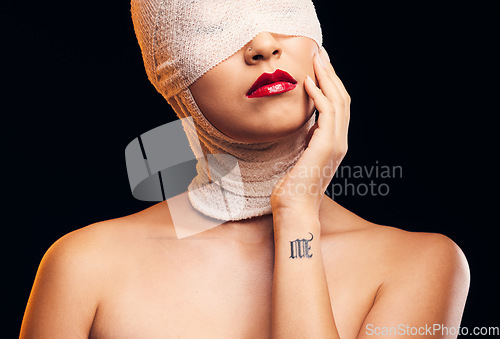 Image of Bandage, plastic surgery and a woman with cosmetics on a dark background for a medical procedure. Beauty, healing and a girl or model after botox or facial change isolated on a studio backdrop