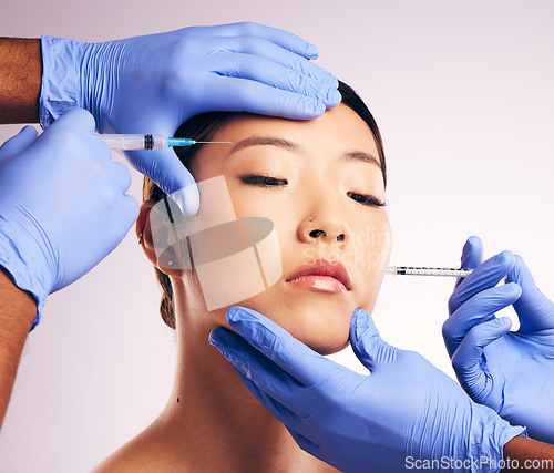 Image of Skincare, injection and Asian woman with plastic surgery, blue gloves or smooth skin against a white studio background. Japanese, female person or model with needles, cosmetic treatment and face care