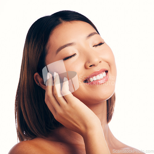 Image of Skincare, wellness and face of happy Asian woman on a white background for beauty, spa and cosmetics. Dermatology, salon and isolated female person with natural skin, satisfaction or facial in studio