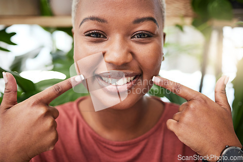 Image of Portrait, smile and black girl is pointing at teeth with happiness for dental hygiene in outdoor. Oral health, face and happy with woman for wellness with mouth for tooth whitening is excited.