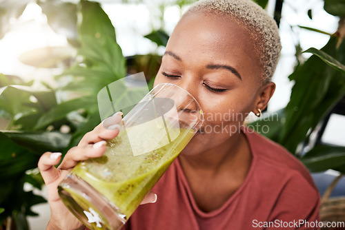 Image of Black woman, diet and smoothie drink for vitamins, fiber or health and wellness in eco friendly store. Face of African female person drinking healthy beverage or organic fruit juice to lose weight