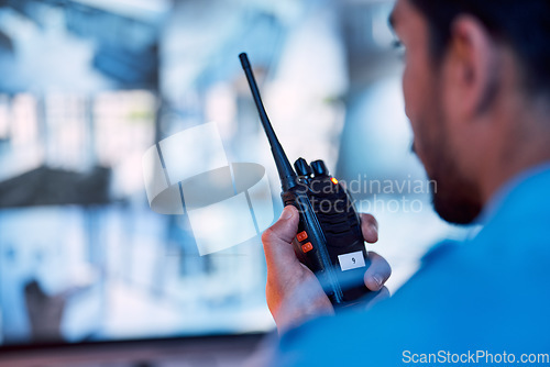 Image of Security guard, radio and cctv monitor, communication and inspection service for building safety. Screen, video surveillance agency and law officer in control room talking on two way intercom system.