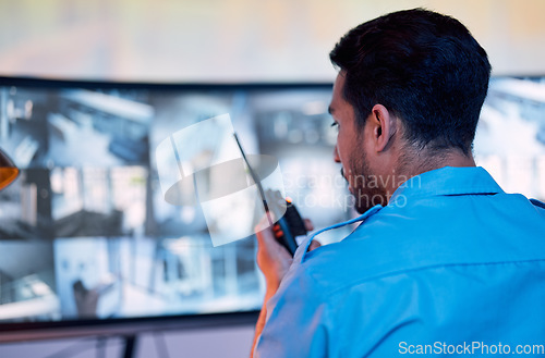 Image of Security guard, radio and cctv screen, communication and inspection service for building safety. Monitor, video surveillance agency and law officer in control room talking on safe intercom system.