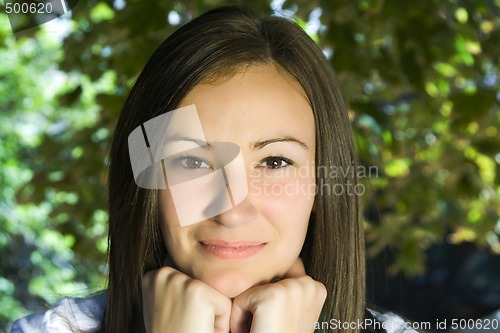 Image of Beautiful Teenager with Leaves in the Background