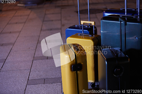 Image of Luggage consisting of six polycarbonate suitcases standing on the street