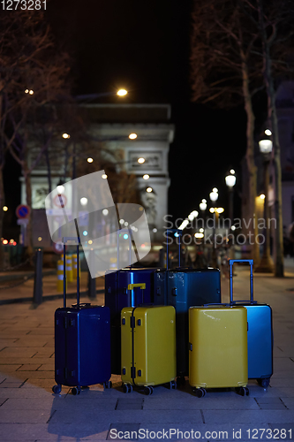 Image of Luggage consisting of six polycarbonate suitcases standing on the street